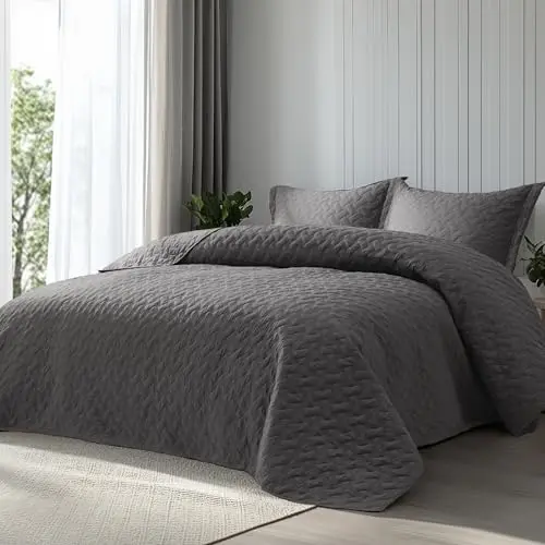 Bedsure grey quilt with basket weave pattern on a bed