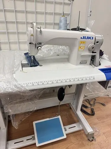 Juki DDL-8700 industrial sewing machine with table and servo motor