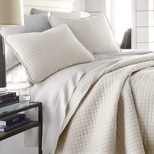 Southshore bone color quilt with modern stitching on a king bed