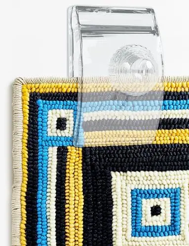 Quiltera transparent acrylic quilt hangers showing quilt pattern through clear material