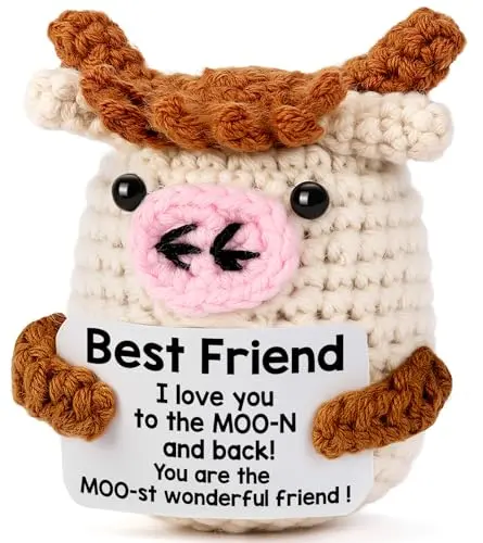 Handmade knitted cow doll with positive messages