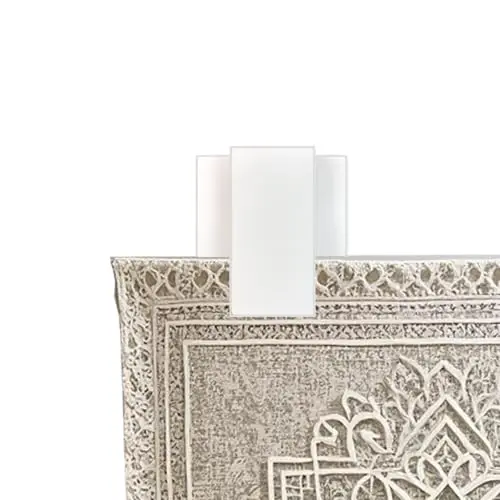 Klizdum white adhesive quilt clips mounted on smooth wall surface